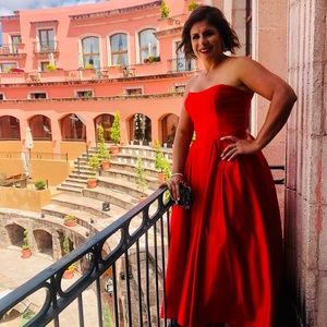 Beautiful red gown, ideal for a formal event.